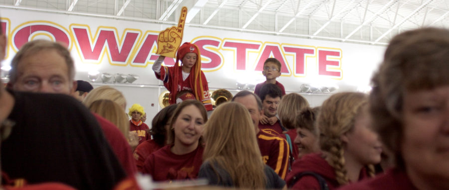 Fans wait excitedly minutes before the football team arrives at Bergstrom Indoor Practice Facility on Saturday, Oct. 23. The Cyclones defeated the Longhorns earlier in the day 28-21.