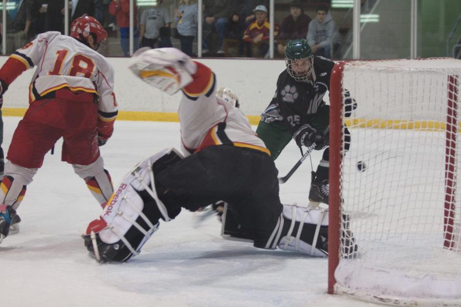 Ohio forward Tyler Pilmore scores against goalie Erik Hudson on Friday, Oct. 29 at the Ames/ISU Ice Arena. The Cyclones were defeated by the Ohio Bobcats 4-1.