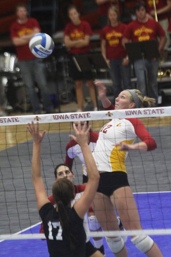 Middle blocker Debbie Stadick jumps for a spike during the game on Wednesday, Oct. 13th at Ames High School against Kansas State. Photo: Zunkai Zhao/Iowa State Daily