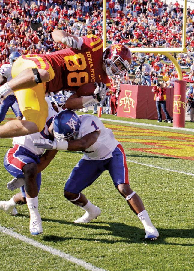 Tight end Collin Franklin attempts to jump over the defense and into the end zone during the game on Saturday, Oct. 30, against Kansas at Jack Trice Stadium. The Cyclones scored a touchdown in the next play.
