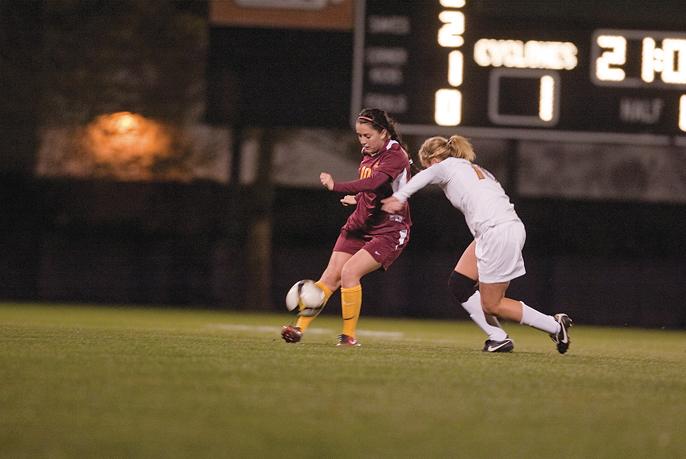 Midfielder Emily Goldstein attempts to go around a Missouri defender during the game Friday night at the ISU Soccer Complex. Goldstein scored a goal to help the Cyclones defeat the Tigers 5-0 in their final game of the season at home.