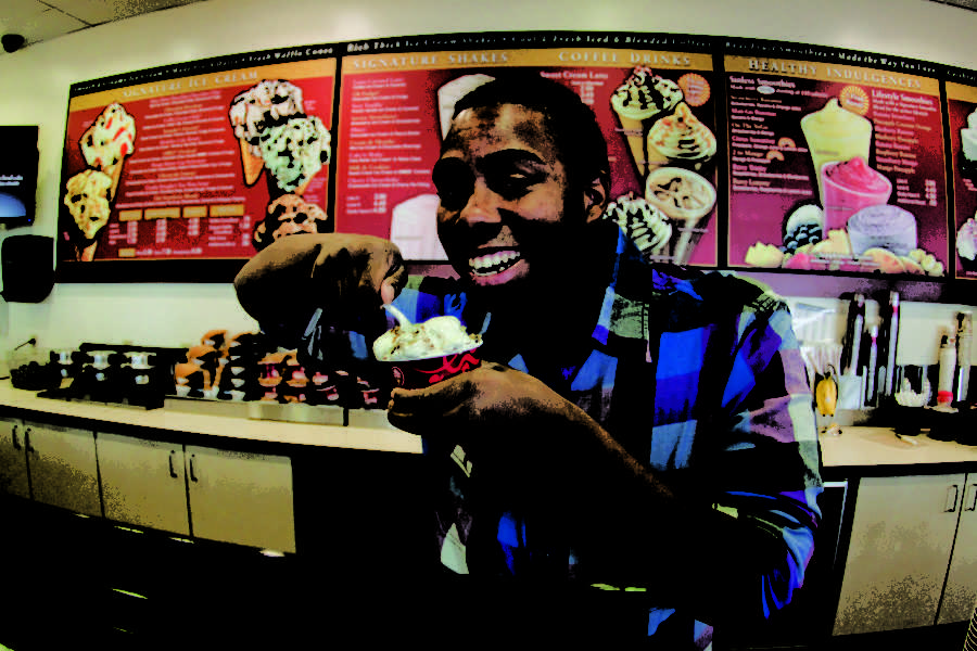 Scotty Locke, junior in political science and international studies and member of Acacia Fraternity, tries out his own ice cream, Acacian Sensation.