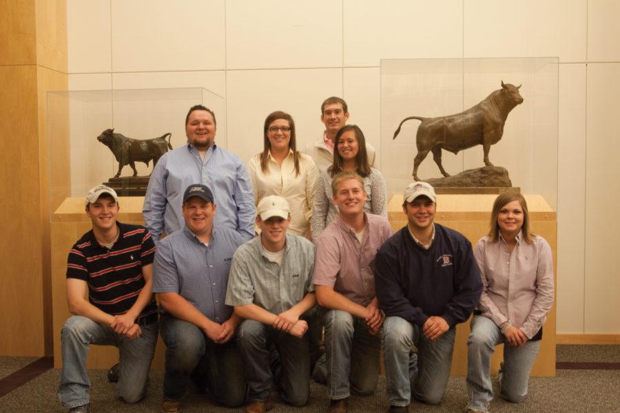 The ISU Livestock Judging Team poses beside two of the national championship trophies past teams have won. ISU has won 20 national championships — more than any other university. Front row — Jason Lents, senior in agricultural engineering; Trever Shipley, junior in animal science; Andrew Noland, junior in agricultural studies; Blake Vander Molen, senior in animal science; Levi Johnson, senior in animal science; Jalane Alden, senior in animal science. Back row — Jonathan Declerck, lecturer in animal science and ISU Livestock Judging Team coach; Kaylee Keppy, senior in animal science; Cameron Luedtke, junior in animal science; and Ashley Wiebe, senior in agriculture and life sciences education.
