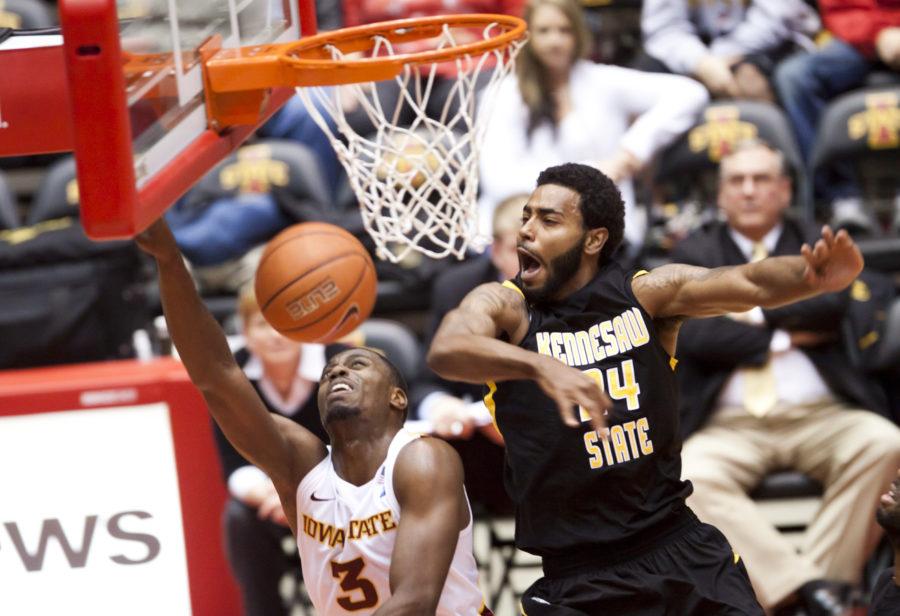 Kennesaw States Artie Marine fouls on Iowa States Melvin Ejim during the Cyclones game against the Owls on Wednesday, Nov. 24. The Cyclones were up 48-29 at the half and won 91-51