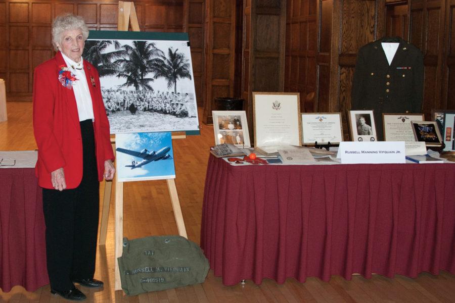 Elaine Vifquain poses with her items of rememberance of her brother Russell Manning Vifquain, Jr. after the Gold Star Ceremony in the Memorial Unions Great Hall on Nov. 11. The ceremony marks the first official memorial of Vifquain, Jr. since his death on May 15th, 1945 near Iwo Jima. Vifquain is grateful of the ceremonys ability to remind todays young generation of the trials and tribulations of our countrys veterans. 
