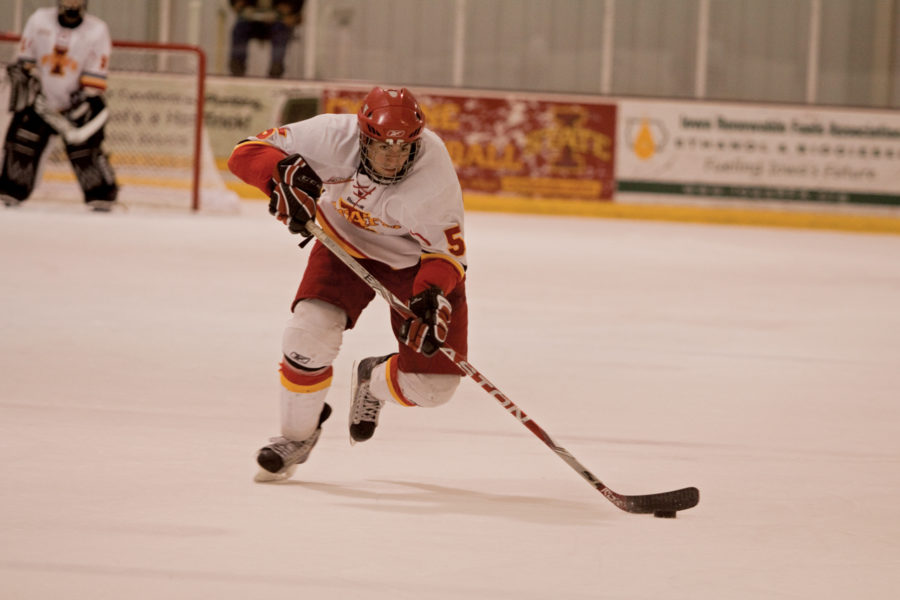 Defenseman Justin Wilkinson races with the puck towards Davenports goal during Saturdays game at the Ames/ISU Ice Arena. The Cyclones defeated the Panthers 5-3.