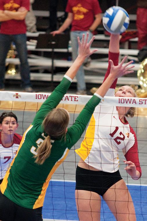 Iowa States Debbie Stadick tips the ball towards Baylors Elizabeth Graham on Wednesday at Ames High. Stadick landed four kills during the Cyclones 3-0 win over the Bears. 