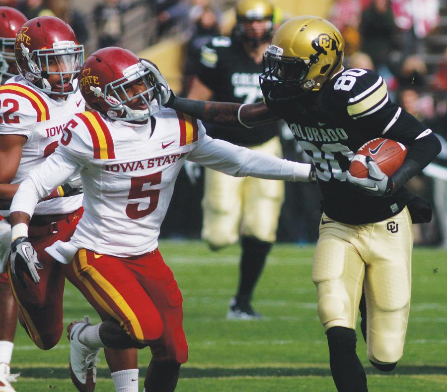 Colorado wide receiver Paul Richardson stiff-arms Iowa States defensive back Jeremy Reeves during the game Saturday, Nov. 13, at Colorado. Richardson tallied 121 total yards against the Cyclones.