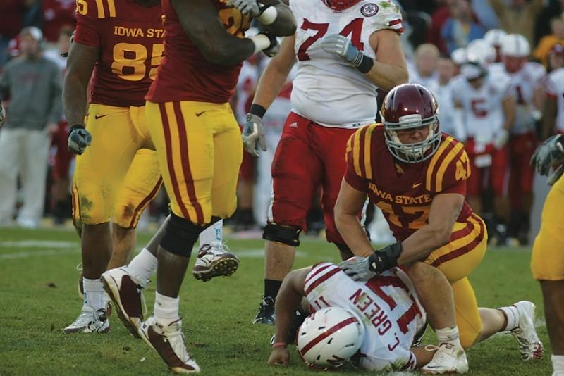 Iowa States A.J. Klein gets back to his feet after a tackle agains Nebraskas Cody Green on Saturday at Jack Trice Stadium