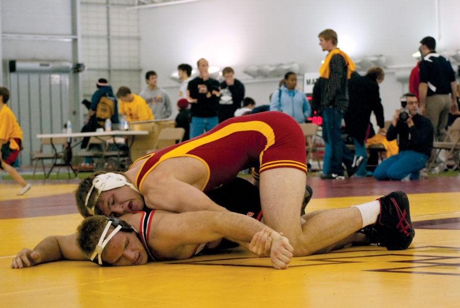 Iowa State wrestler Kyle Simonson pins Wartburg Colleges John Helgerson in the final round for the 285-pound wrestling championship of the Harold Nichols Open on Saturday at the Bergstrom Indoor Training Facility. Simonson made it to the final round and defeated Helgerson 8-2.