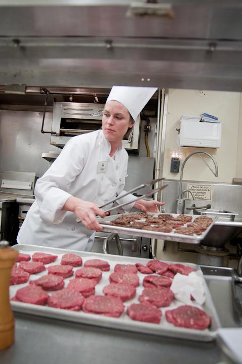 Staci Howlett, senior in culinary science, prepares beef tenderloins for a Tuscan dinner on Wednesday at the Joan Bice Underwood Tea Room in MacKay Hall. The tenderloin was topped with parmesan and fontina cheese, then served on homemade tomato sauce and polenta.