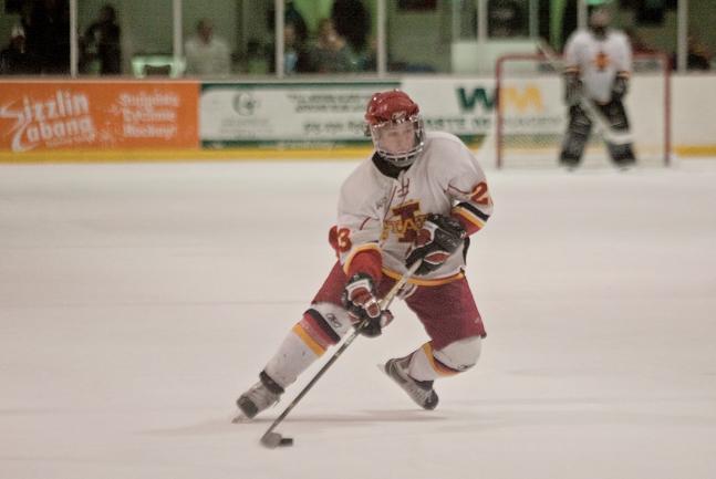 Forward Chris Cucullu skates with the puck during the Iowa State-Davenport on Saturday, Oct. 16. 