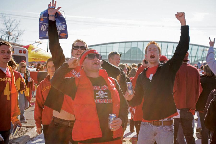 Nebraska fans walk bravely through Victory Lane while cheering for their team on Saturday, Nov. 6. The Cyclones lost to the Huskers 31-30 in overtime.