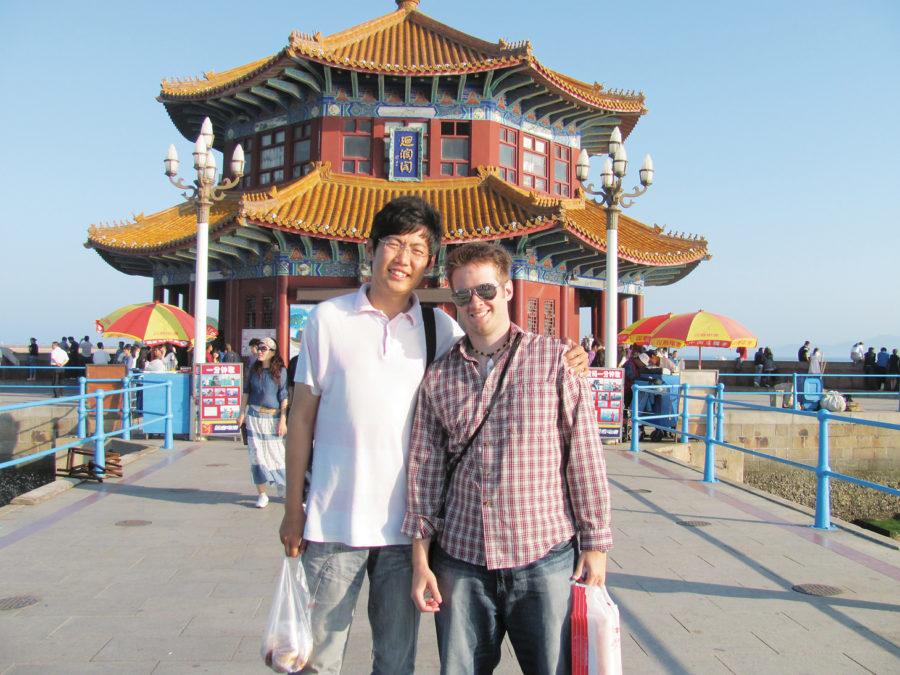Nicholas Woodley and his Chinese roommate pose near a temple in Qingdao, China. 