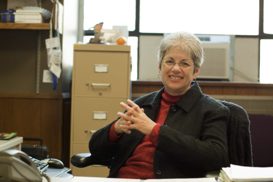 Bonnie Bowen, associate professor of ecology, evolution and organismal biology sits behind her desk. Bowen is the director of the ISU Advance Program, which encourages women to enroll in the sciences.