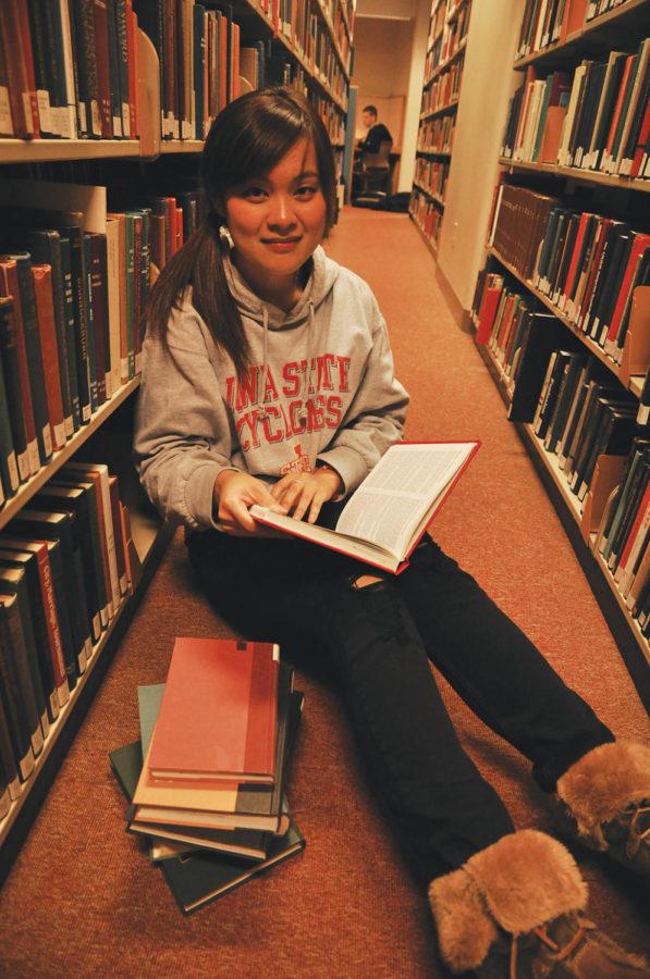 Mengmeng Liu, senior in accounting, studies in Parks Library. Liu came to Iowa State from China. 