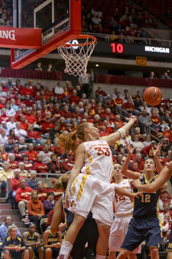 Forward Chelsea Poppens attempts a rebound over Michigan during the game Sunday at Hilton. Poppens lead the team in rebounds with a total of 10.