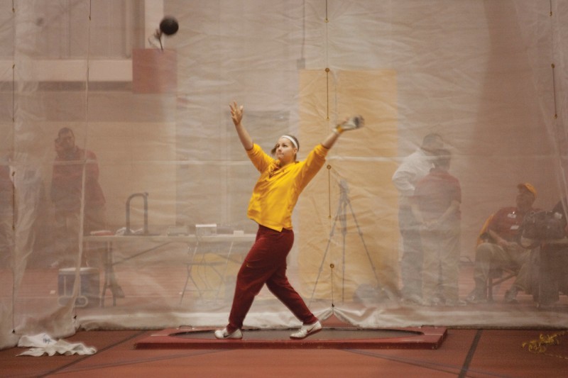 Thrower Britta Christofferson practices her form before the start of the weight throwing event at the Holiday Preview hosted by Iowa State Friday, Dec. 11, 2009 at Lied Rec Center. 