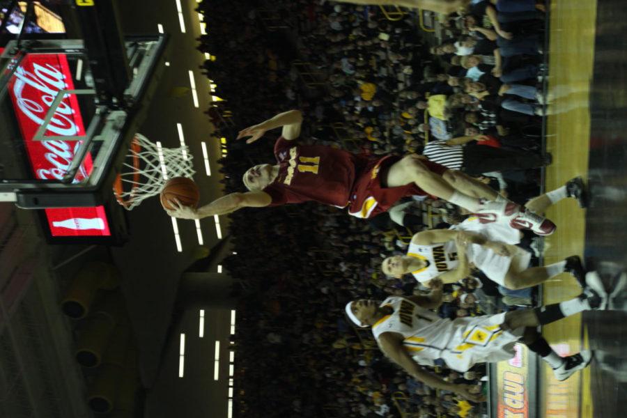 Guard Scott Christopherson drives for a layup late in the second half against Iowa on Friday, Dec. 10 at Carver-Hawkeye Arena. Christopherson posted a career-high 30 points.
