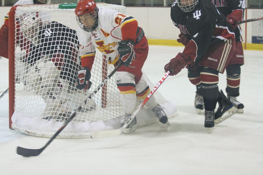 Forward Mike Lebler rushes past the Indiana defense to get the puck to the goal Nov. 12 against Indiana University. The Cyclones defeated the Hoosiers 7-1 that night in the ISU/Ames Ice Arena. 