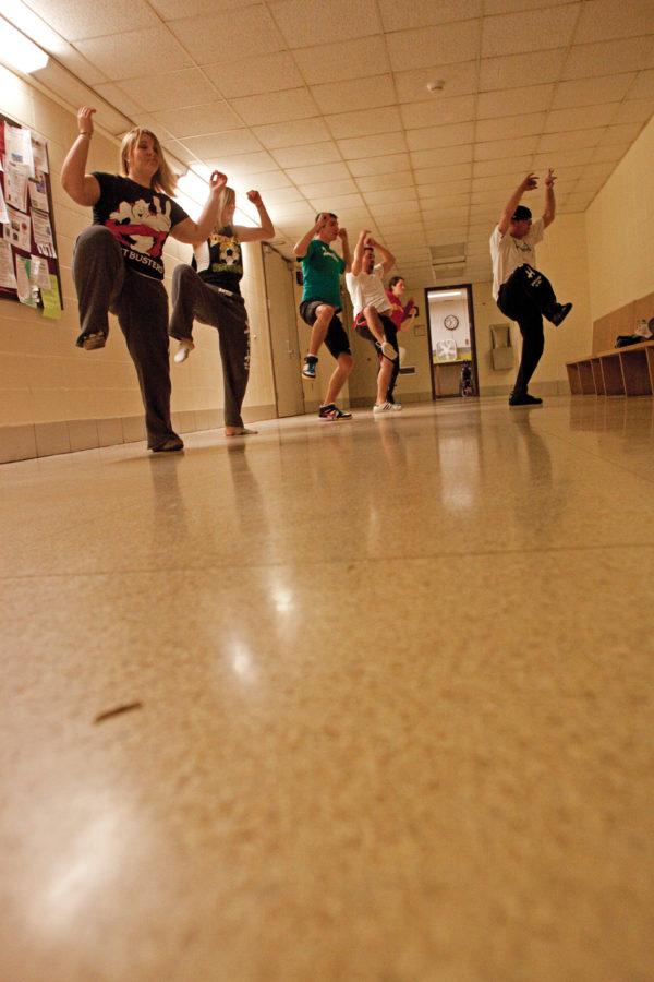 Members of Dub H practice in a hallway in Forker Wednesday, Dec. 1 in preparation for their upcoming performance. Dub H members were spread out through the building rehearsing.