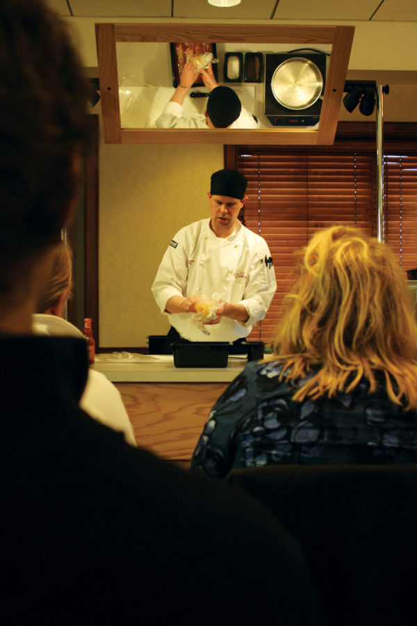 Jeremy Bowker, sous chef at Seasons Market Place, teaches a cooking class to a group of students from Frederiksen Court on Sunday, Jan. 30 at Hawthorn Community Center.