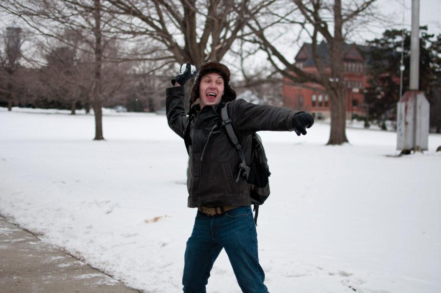 Eric Thiel, junior in history, throws a snowball at his friend during the Global Warming Snowball Fight, by the ISU Republican, Wednesday, Jan. 26 on Central Campus.
