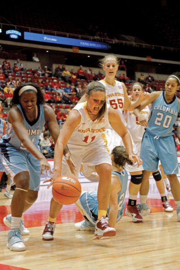 Guard Kelsey Bolte rushes to keep the ball from Columbia opponents during the game on Sunday at Hilton Coliseum. Bolte went 4-11 on field goals and five rebounds and 11 points to help the Cyclones defeat the Lions 73-27.