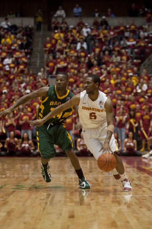 Guard Jake Anderson moves the ball down the court during the second half of the game against Baylor on Saturday, Jan. 15. Baylor lost to Iowa State with a score of 72-57.