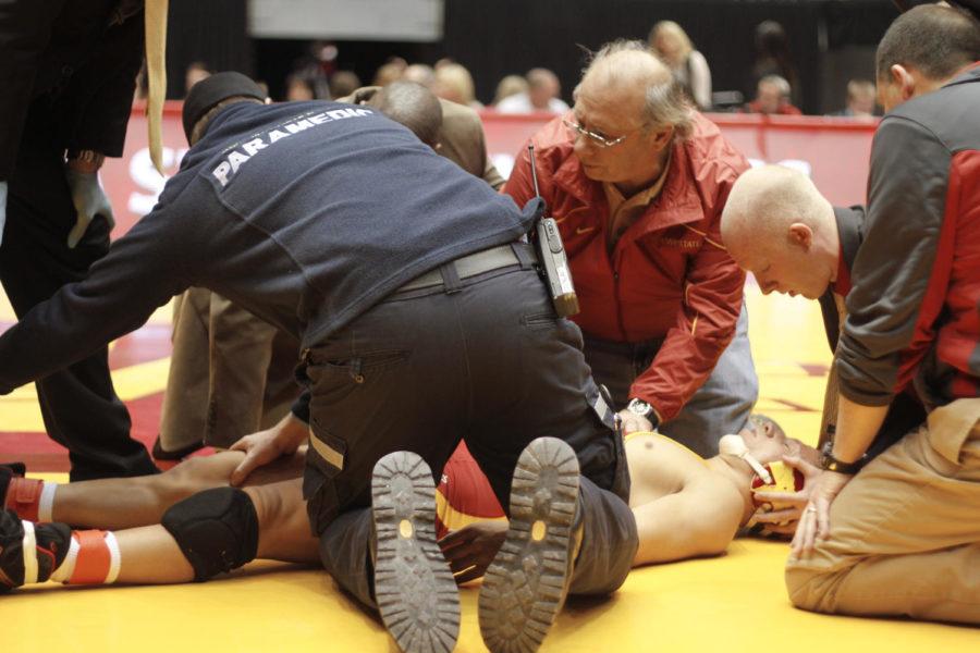 Paramedics try to revive Trent Weatherman after being choked out by an Oklahoma opponent during the Beauty and the Beast event Friday, Jan. 22, at Hilton Coliseum.