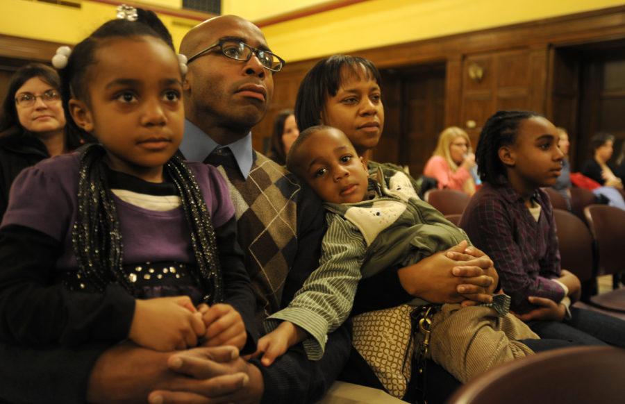 Anthony Jones sits with his family during the Dr. Martin Luther King Jr. Holiday Program on Thursday, Jan. 20, in the Great Hall of the Memorial Union. Jones is a 2010 graduate of educational leadership and policy studies department. The Jones family came to support the award recognition of Dr. Mary Sawyer.