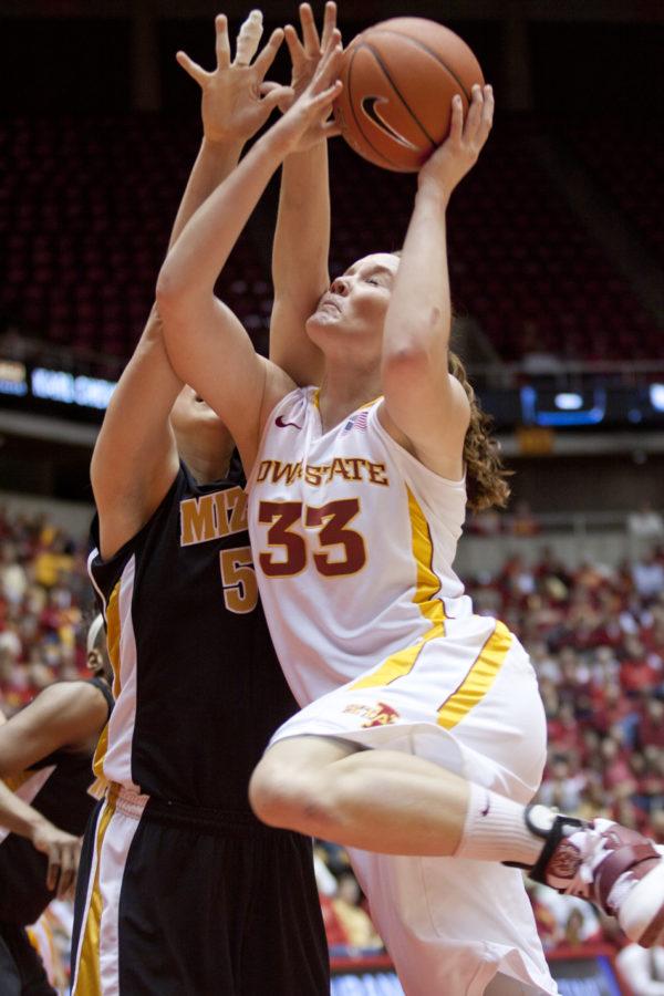 Forward Chelsea Poppens goes in for a layup against a Missouri opponent during the Iowa State-Missouri game Saturday. Poppens scored a total of 12 points and led the team in rebounds with 19.