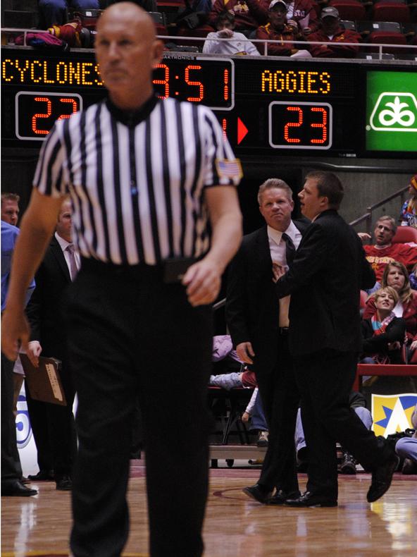 ISU coach Bill Fennelly is held back by his son, Billy, after receiving a technical foul from official Clarke Stevens during Iowa States loss to Texas A&M on Saturday, Jan. 22 in Hilton Coliseum.