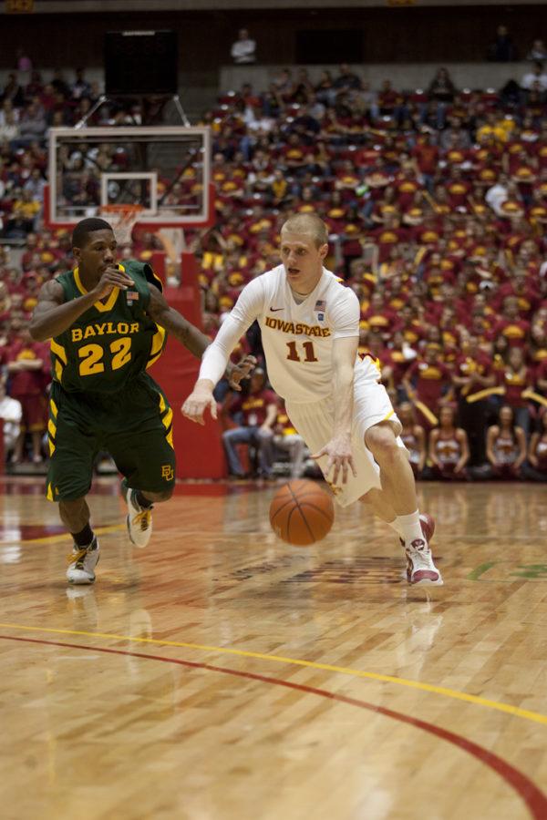 Guard Scott Christopherson drives the ball down the court during the Iowa State-Baylor game Saturday, Jan. 15. Iowa State won with a score of 72-57.