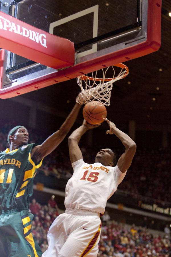 Forward Calvin Godfrey puts the ball up during the game against Baylor on Saturday, Jan. 15. Iowa State won with a score of 72-57. 