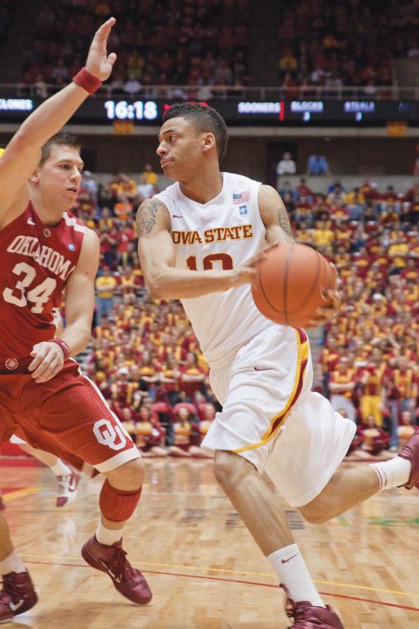Guard Diante Garrett looks to pass the ball to a teammate during the Iowa State — Oklahoma game Saturday at Hilton Coliseum. Garret helped to lead the team with 18 points despite a 82-76 loss to the Sooners.