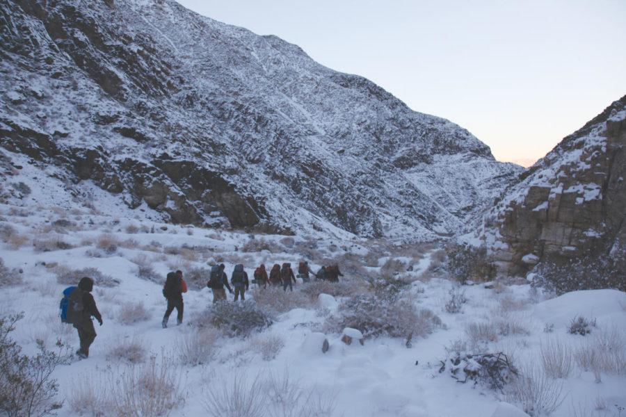 Members of the ISU Outdoor Recreation Program trip to Death Valley National Park backpack down Surprise Canyon on Jan. 4. The group was hit by a snowstorm as it hiked up the trail to Panamint City, a ghost town at the summit.