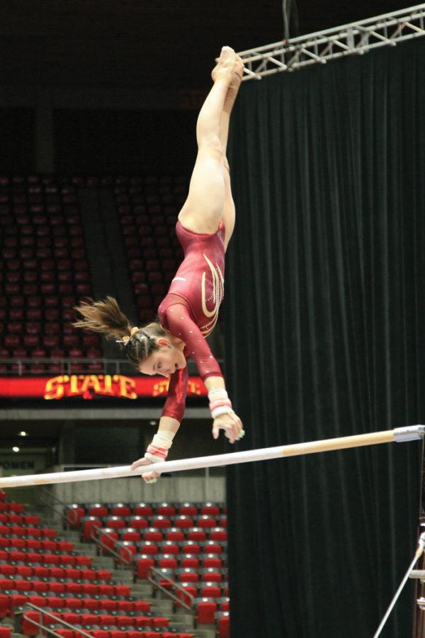 Camille Santerre-Gervais participates in the uneven parallel bars during the Cyclones  meet with Auburn on Friday, Jan. 7 at Hilton Coliseum.