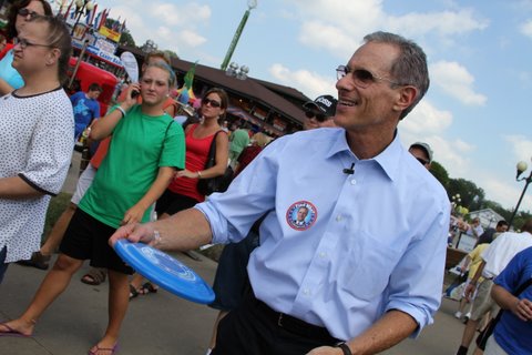 Fred Karger visited Iowa in August 2010 and attended the Iowa State Fair, passing out merchandise such as buttons, frisbees and stickers with his name on it.