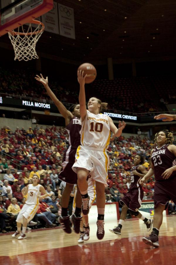 Guard Lauren Mansfield lays the ball up in th esecond half against the Aggies. Despite their best efforts and some controversial officiating, the Cyclones lost 51-60. 