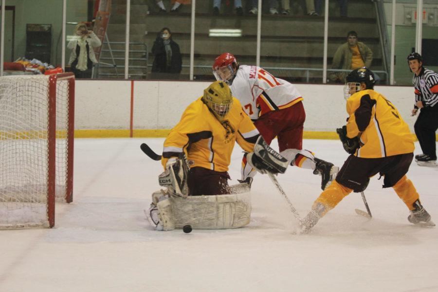 Forward Marcus Malmsten finishes a goal during Saturdays game against Minneosta Crookston at the Ames Ice Arena. The Cyclones defeated the Golden Eagles 14-2.