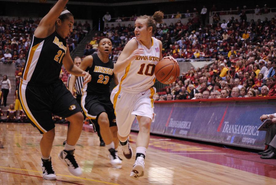 ISU guard Lauren Mansfield tries to avoid a Missouri double team in the second half of the Cyclones 71-56 win over Missouri on Saturday, Jan. 29 at Hilton Coliseum. 