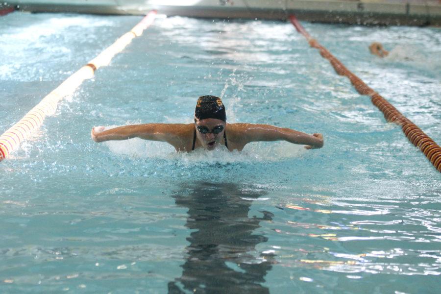Sophomore Elena Carvell competes in the 100-yard butterfly event during the swim meet on Saturday, Oct. 30. Carvell took first place in the event with a time of 58.16.