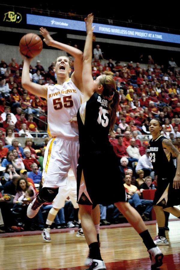ISU center Anna Prins goes up for a shot against Colorado forward Julie Seabrook during the Saturday game against the Buffaloes at Hilton Coliseum. Prins contributed 10 points to the 71-45 Cyclone win over the Buffaloes.