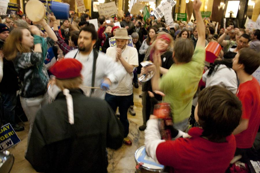 Protesters dance to the playing of drums inside the Wisconsin Capitol building Monday, Feb. 21. The main floor of the rotunda was considered the epicenter of the Madison protests. 