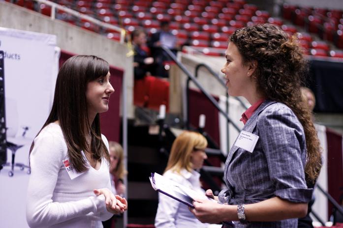 Cherann Boughton, senior double majoring in management and French, speaks with a recruiter for HNI Corporation during the Business, Liberal Arts & Sciences and Human Sciences Career Fair. The Career Fair was held on Wednesday Feb. 9, 2011in Hilton Coliseum and was free to ISU students.