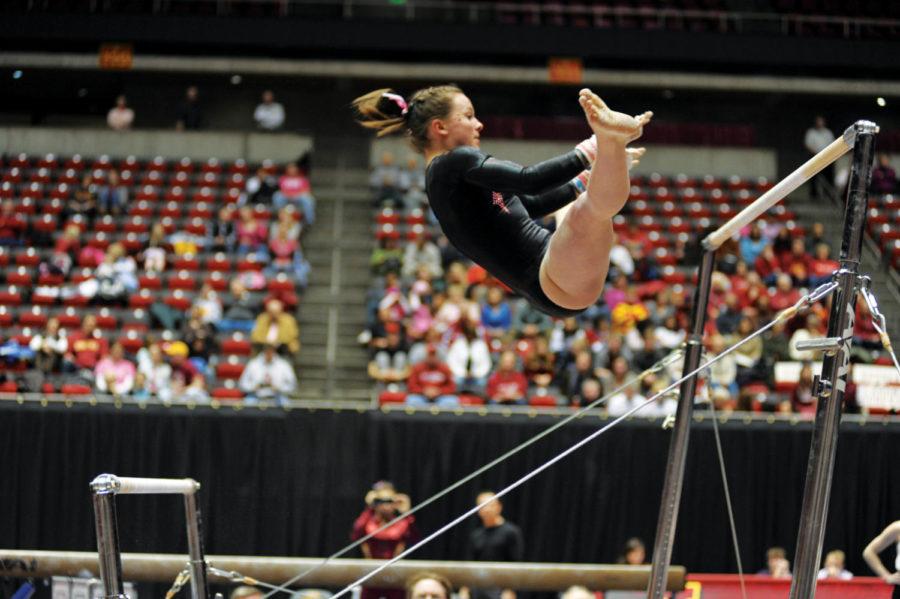Cyclone+Michelle+Shealy+performs+during+the+meet+against+Oklahoma+on+Friday%2C+Feb+11+at+Hilton+Coliseum.+Michelle+Shealy+contributed+9.675+on+the+uneven+bars.++