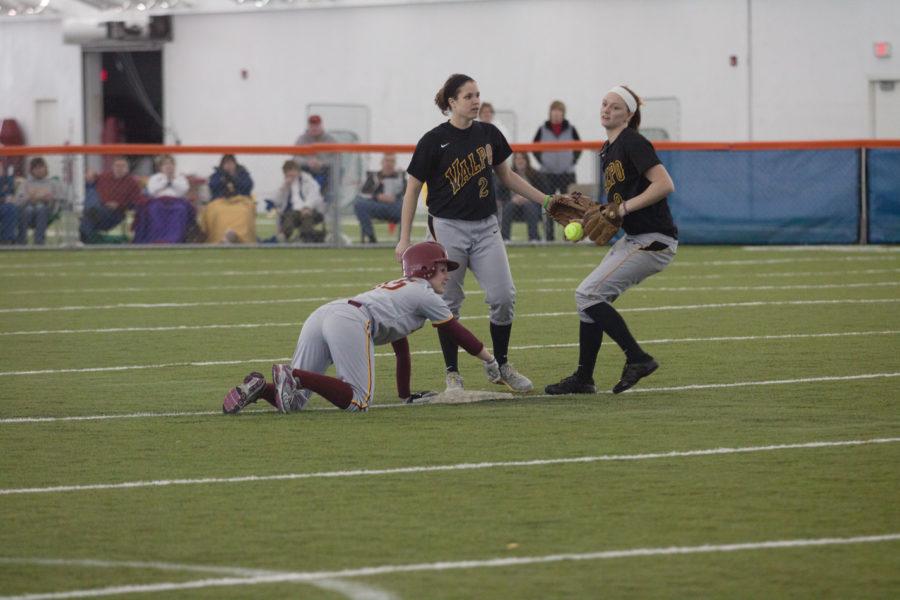Heidi+Kidwell+slides+into+second+base%2C+avoiding+a+Valparaiso+opponent+during+the+softball+game+Feb.+13+at+the+Bergstrom+Indoor+Training+Facility.