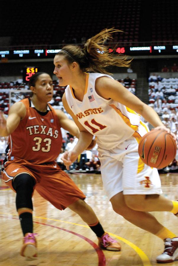 Iowa State guard Kelsey Bolte breaks past Texas guard Ashleigh Fontenette during the game against the Longhorns at Hilton Coliseum on Feb. 21. The Cyclones defeated the Longhorns in overtime 66-57.