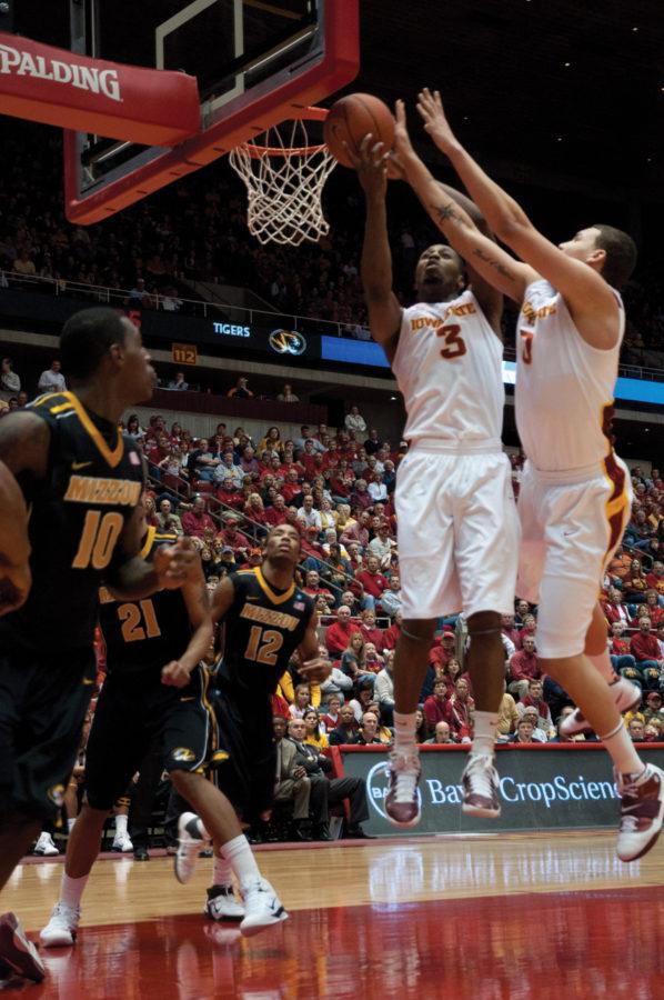 Forward Melvin Ejim attempts to secure a rebound during the first half of the game against Missouri on Saturday at Hilton Coliseum. The Tigers defeated the Cyclones 76-70. 